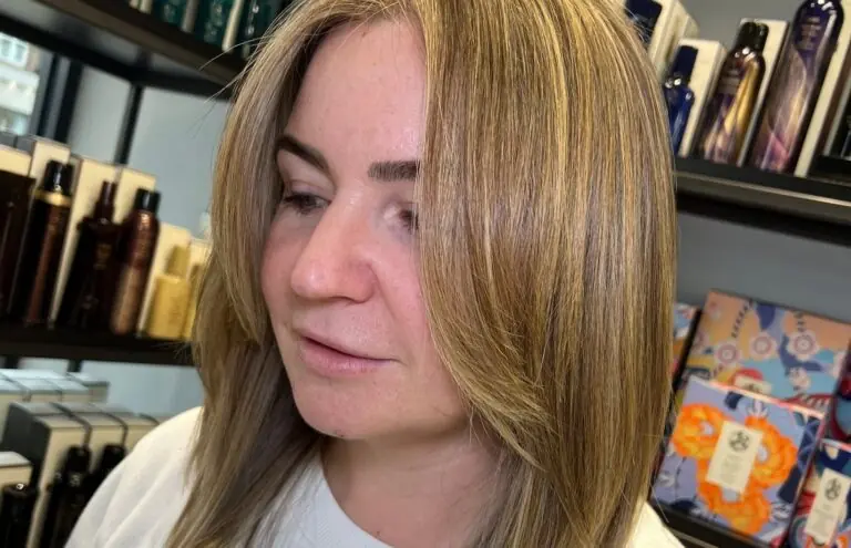 Professional hairdresser in Esher crafting a hairstyle designed to enhance natural features and bone structure.